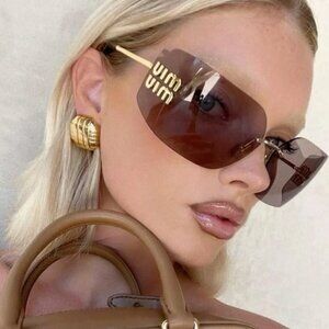 Miu Miu MU54YS 5AK06I Purple Sunglasses